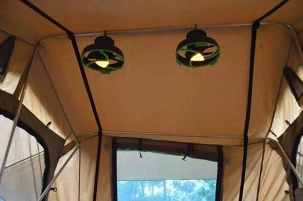 Fans hanging in a family camping tent.
