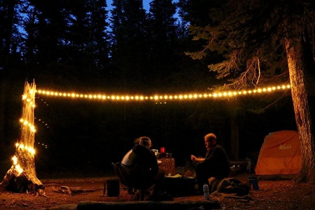 Using string lights while family camping.