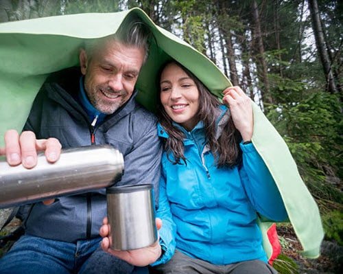 Couple camping in the rain.