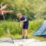 A father and son setting up a family camping tent.