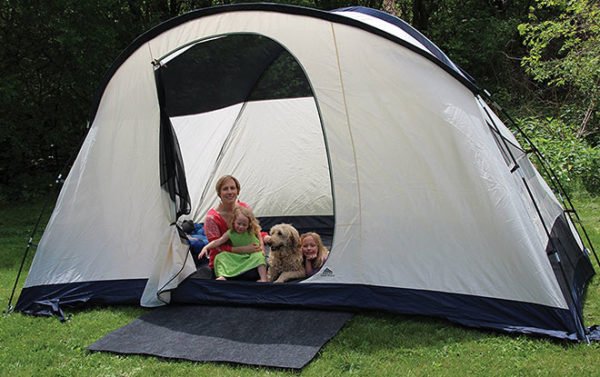 Family camping hack using rugs in and out of the tent.