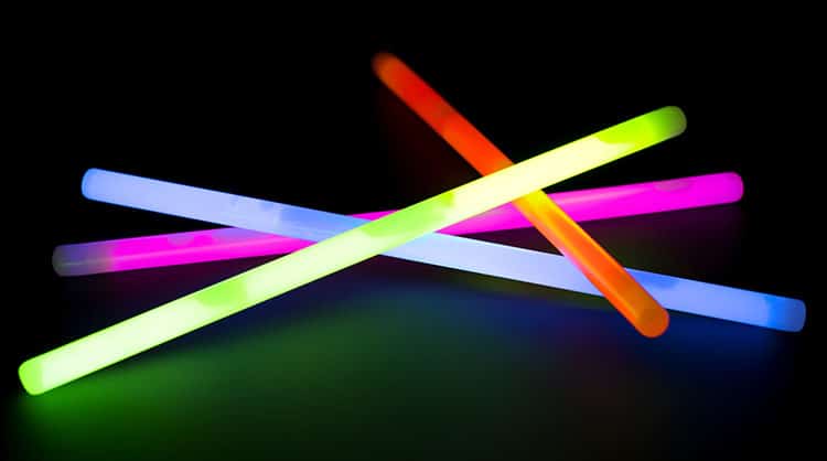 Glow stick night lights in camping tent.