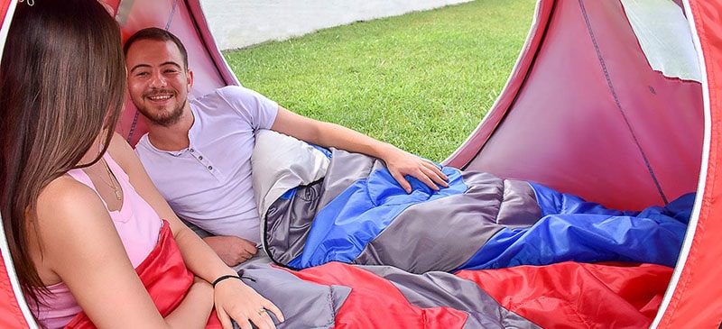 People camping in a tent.